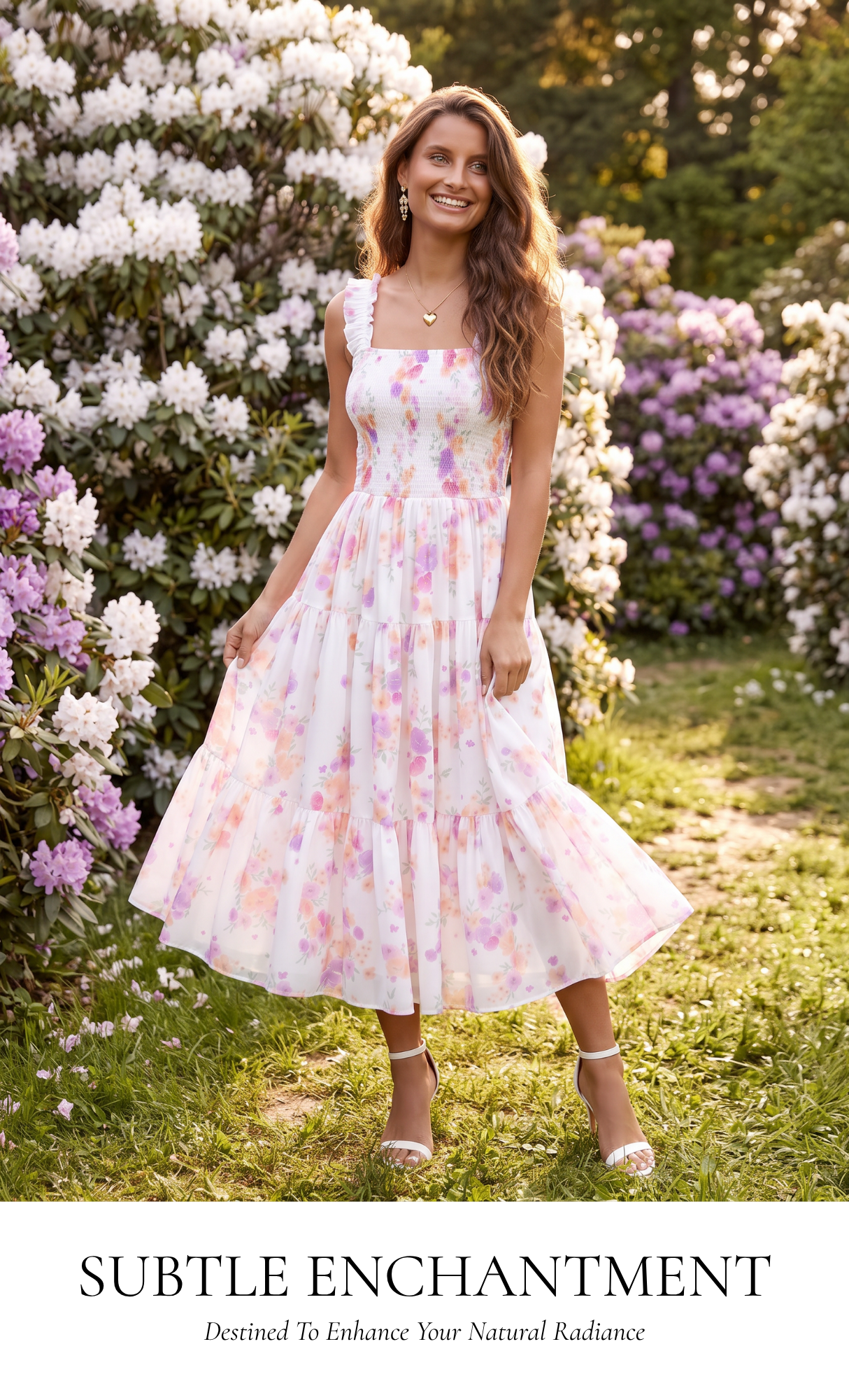 A woman stands in a sunlit garden wearing a sleeveless white midi dress with a soft pink and purple floral print. The photo includes a text banner at the bottom that reads 'SUBTLE ENCHANTMENT' with smaller tagline text.