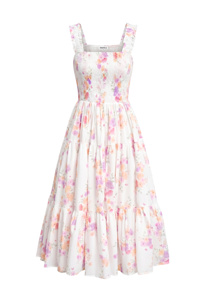 A sleeveless tiered midi dress with a smocked bodice and a soft floral print in pastel pink, purple, and orange on a white background.