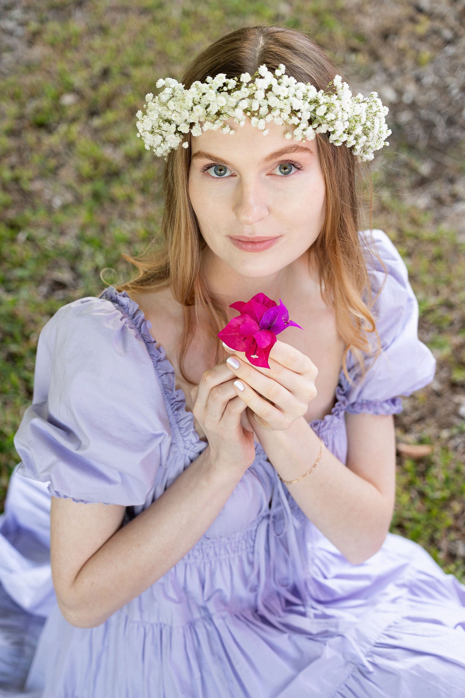 Model wears Penelope Midi Dress Lilac in secret garden